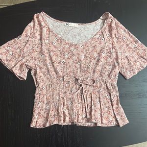 A pink juniors top in size small.